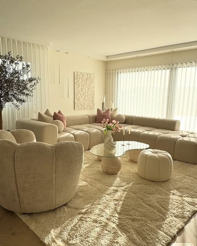 18. Creamy Lounge Setting With Curved Silhouettes - living room sofa ideas
