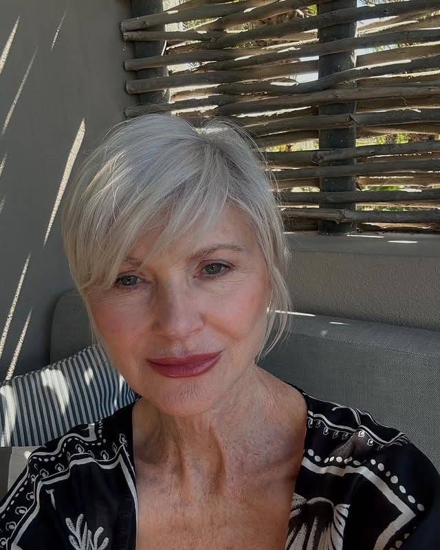 1. Soft Silver Pixie Bob with Side-Swept Fringe - Gray Hairstyles for Women