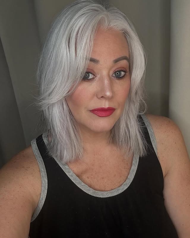 2. Layered Ice-Gray Lob with Face-Framing Movement - Gray Hairstyles for Women