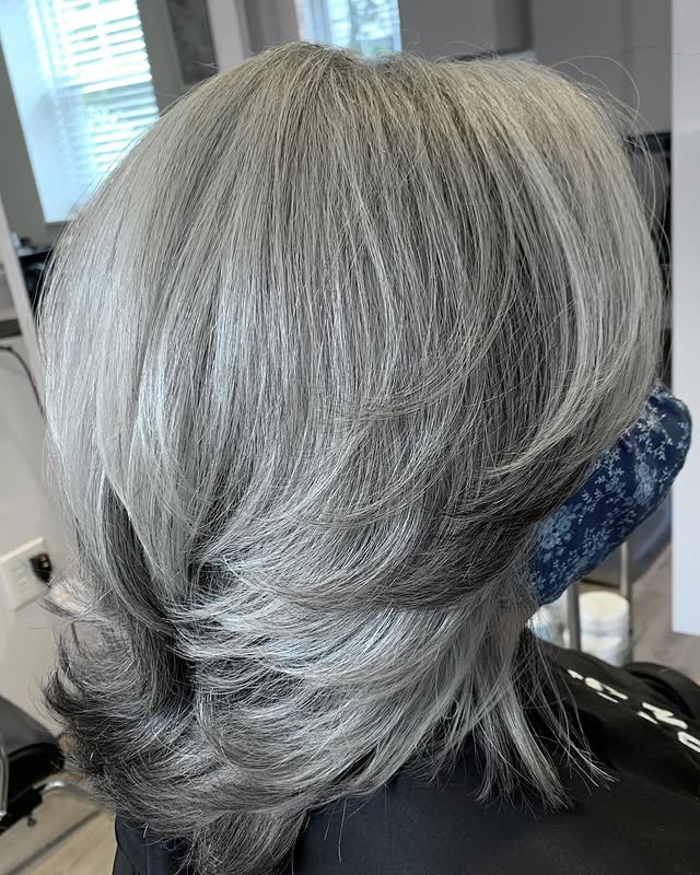 14. Classic Silver Layered Blowout with Rounded Shape - Gray Hairstyles for Women