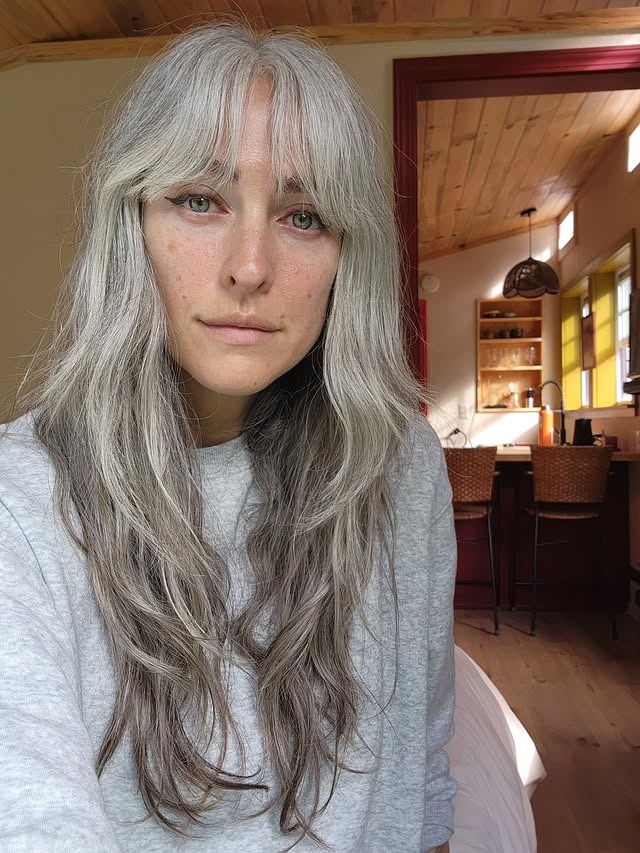 19. Long Feathered Silver with Curtain Fringe - Gray Hairstyles for Women