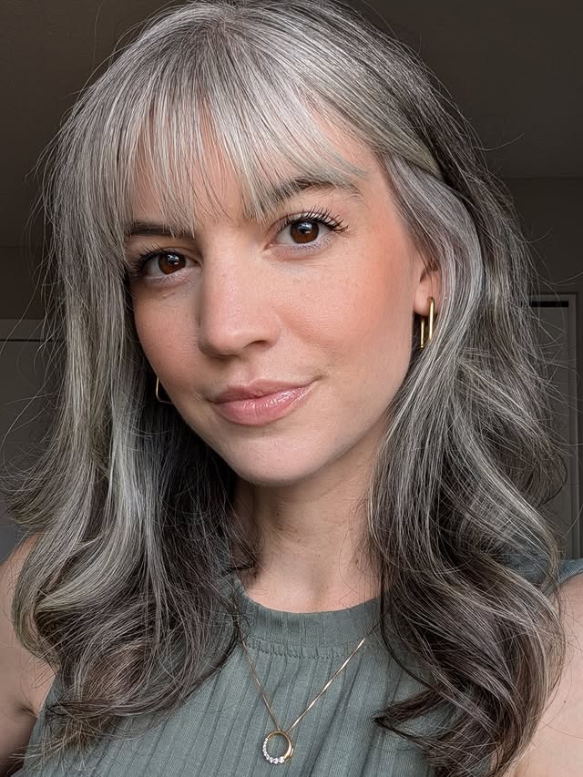 22. Soft Frosted Gray Waves with Light Feathered Bangs - Gray Hairstyles for Women