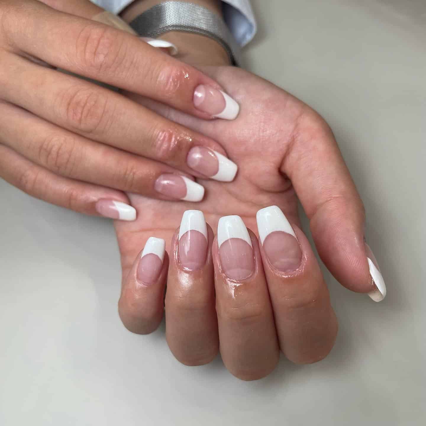 1. Deep Crescent French with Porcelain Tips - white french nail ideas