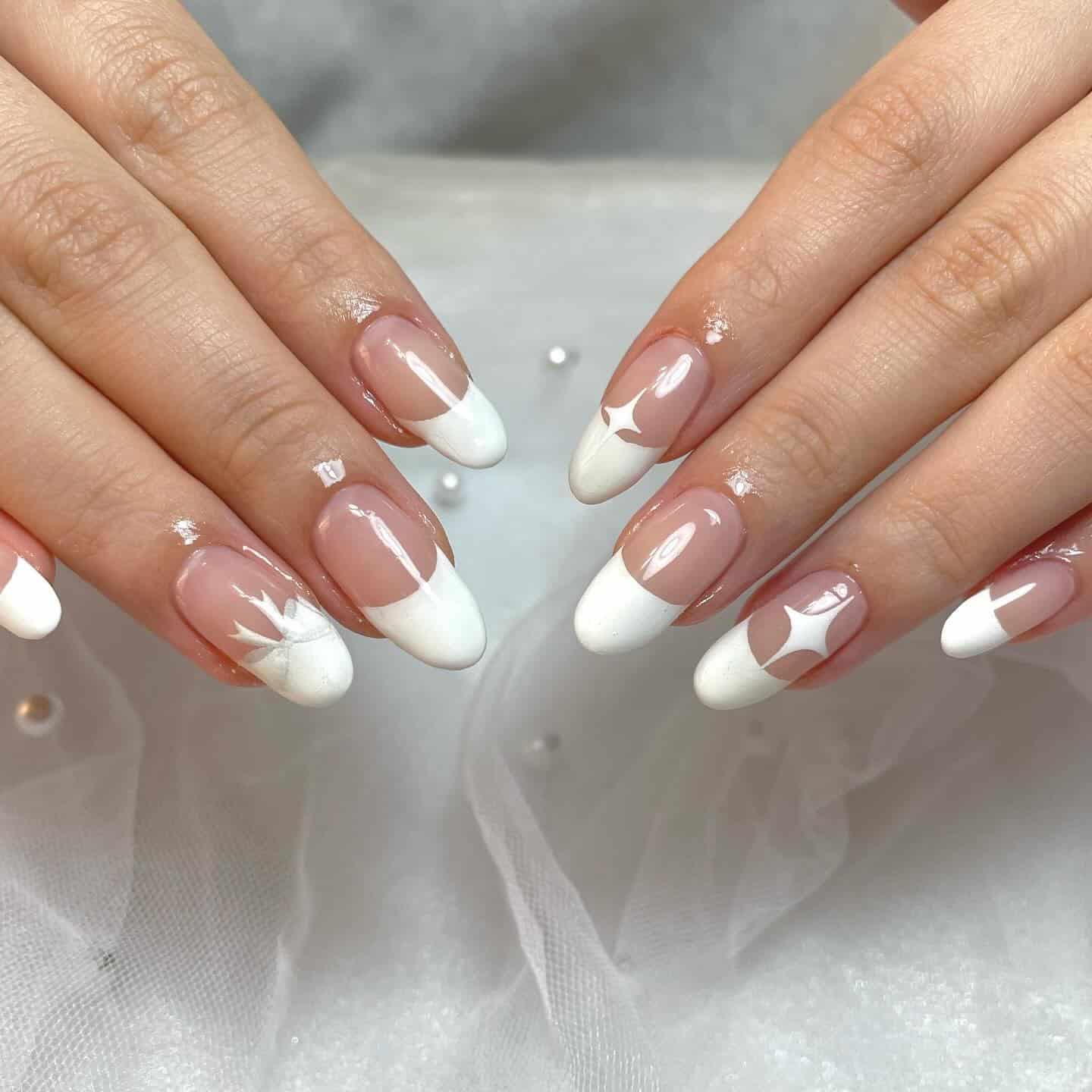 5. French Almond with White Star Accents - white french nail ideas