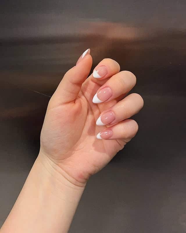 9. Modern Almond French with Defined Side Swoops - white french nail ideas