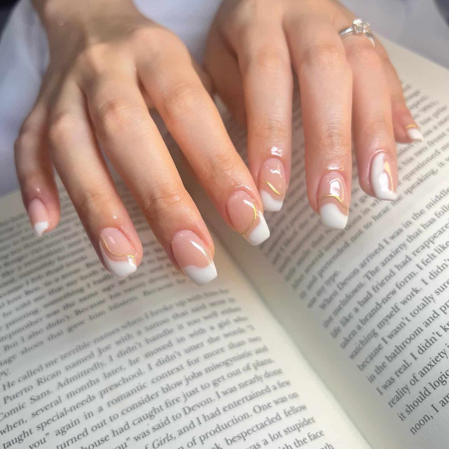 16. Curved French with Gold Detailing - white french nail ideas