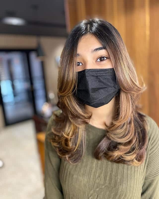 3. Warm Brunette S-Curve Layers with Soft Bounce - Medium-Length Layered Haircuts