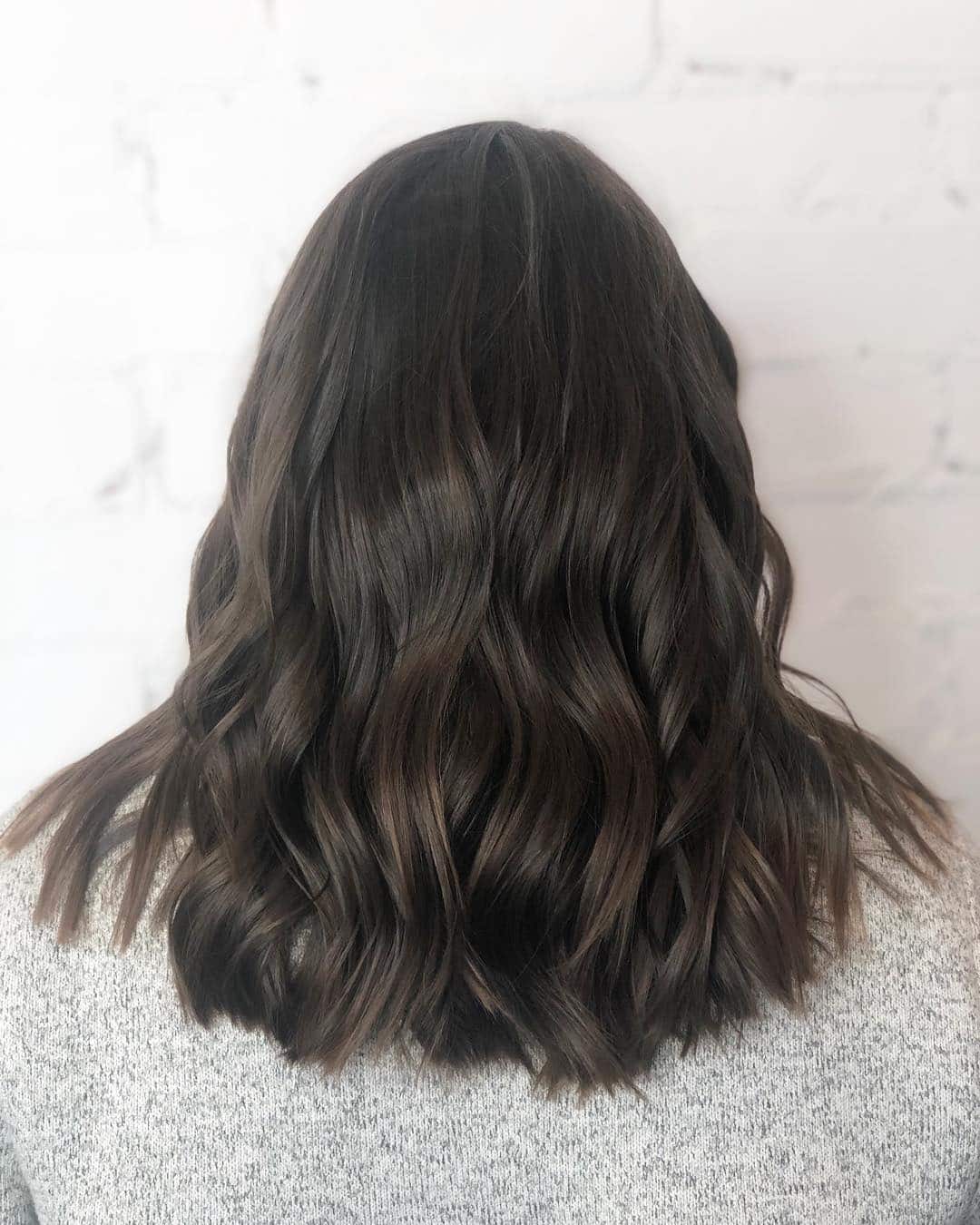 20. Rich Chocolate Waves with Subtle Layers - Medium-Length Layered Haircuts