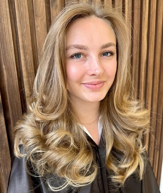 21. Soft Blonde Layered Blowout with Full Volume - Medium-Length Layered Haircuts
