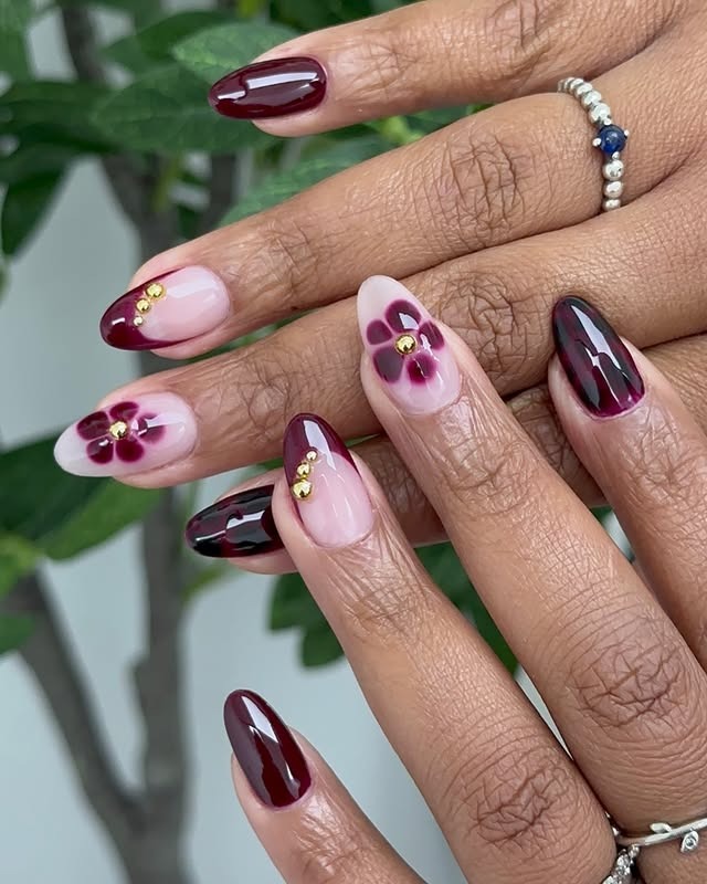16. Wine Floral Almond Art With Gold Details - wine color nail ideas