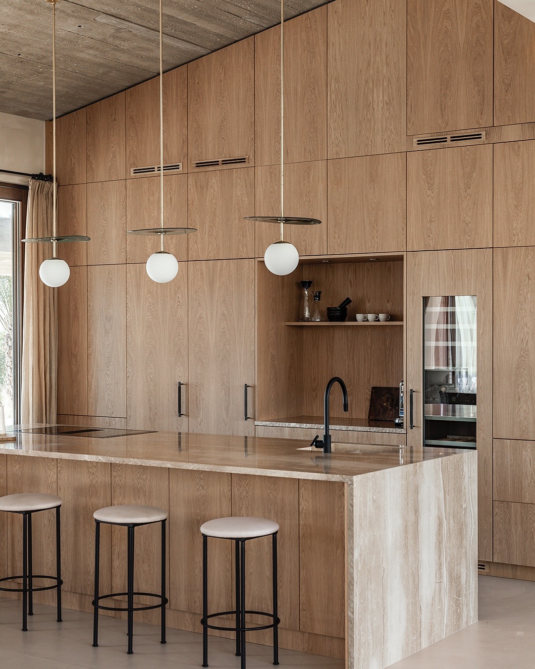 17. Tall Wood Kitchen With Textured Stone Island - wooden kitchen ideas