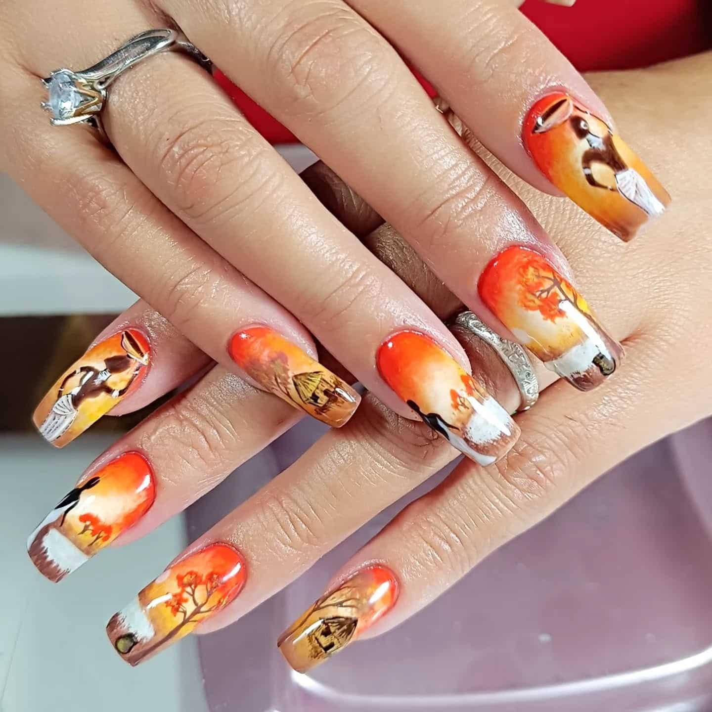 2. Sunset Village Hand-Painted Scene - african nail ideas
