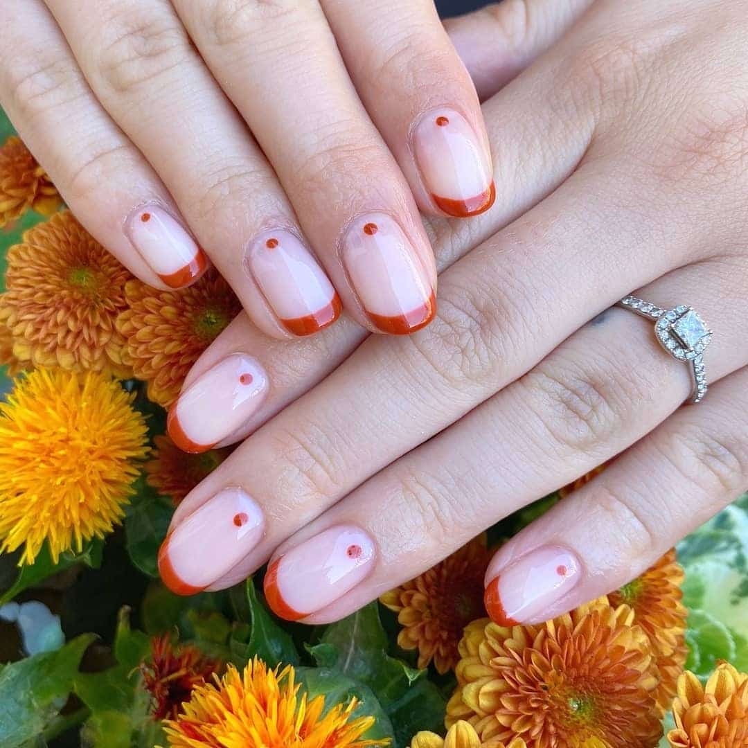 8. Terracotta French Dot Accents - african nail ideas