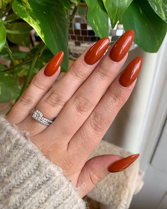 9. Burnt Clay Almond Nails - african nail ideas