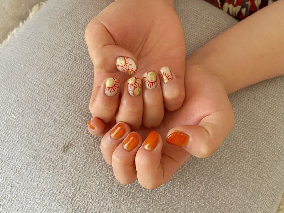 13. Sunburst Tribal Accent Mix - african nail ideas