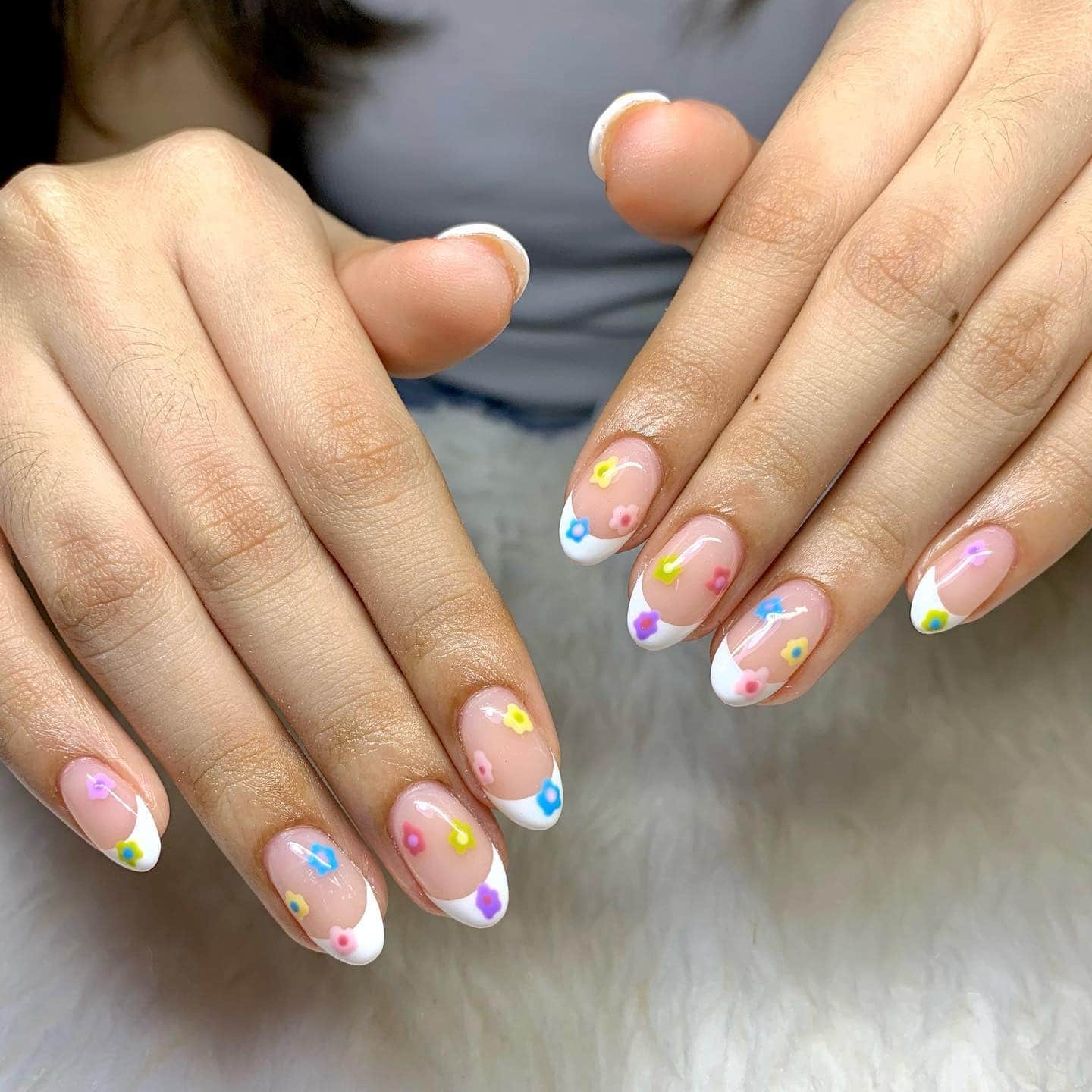 2. Pastel Floral Almond Tips with White French Edges - almond french tip nail ideas