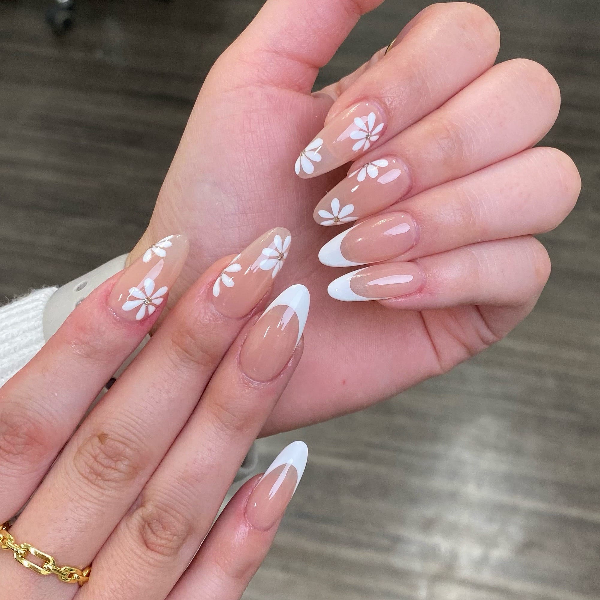 7. Soft White Daisy French Almond Nails - almond french tip nail ideas
