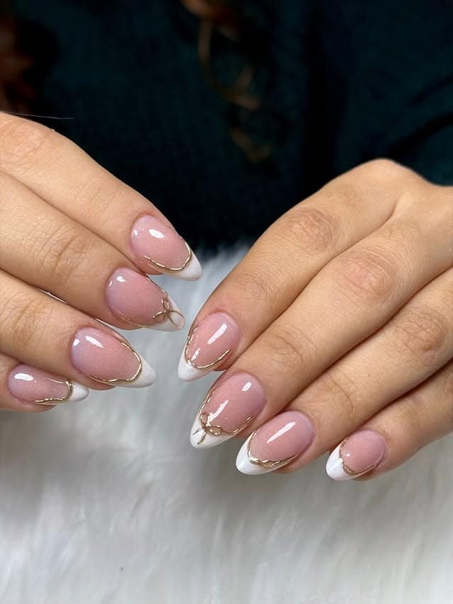16. White Almond Tips with Gold Marble Lines - almond french tip nail ideas