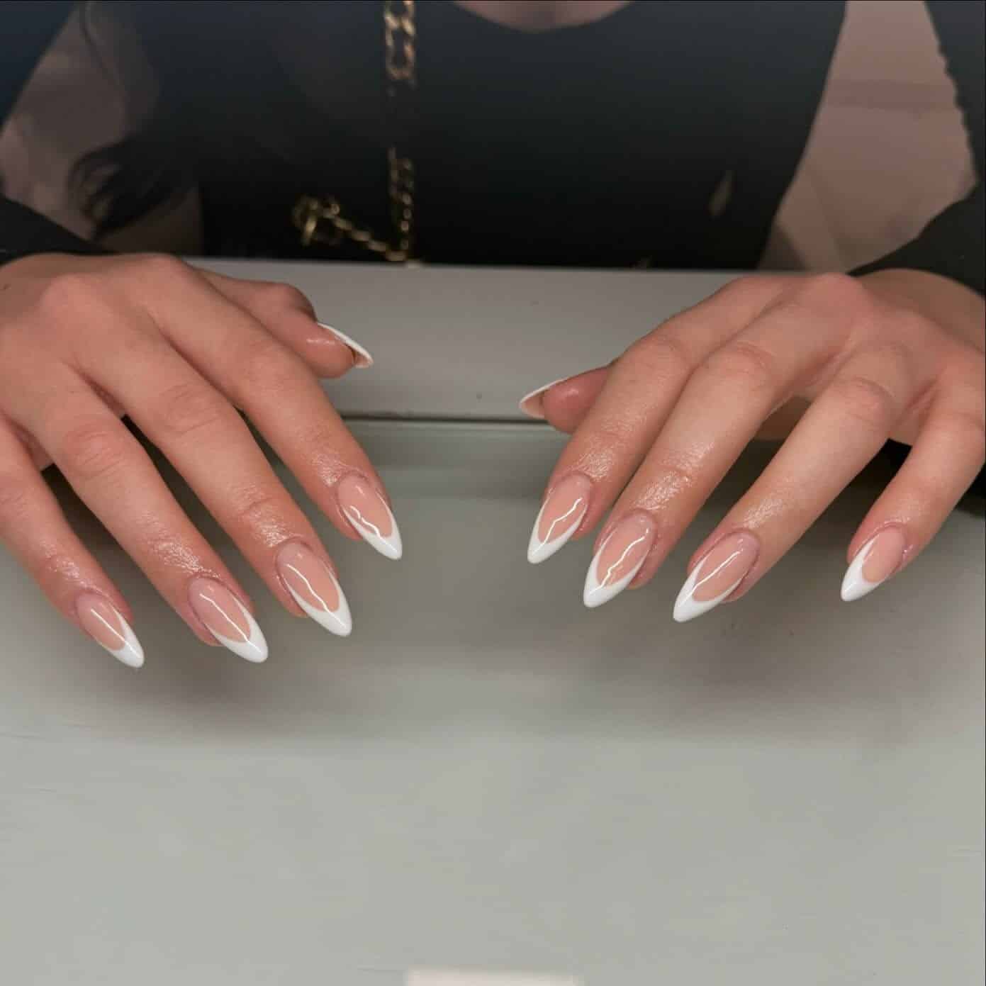 21. Sharp White Almond Outlined French Tips - almond french tip nail ideas