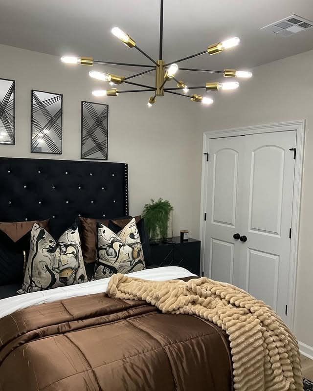 18. Chic Espresso Bedroom with Gold Statement Lighting - black and brown bedroom ideas