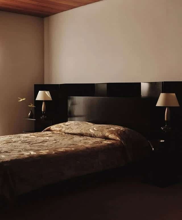 19. Minimalist Cocoa Suite with Soft Diffused Light - black and brown bedroom ideas