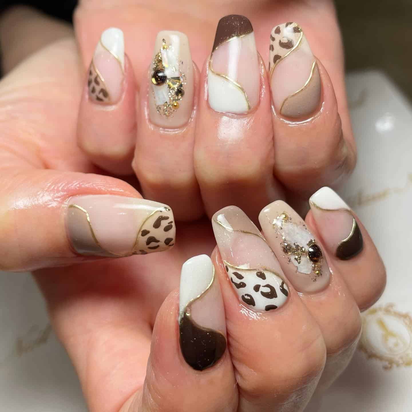1. Chic Neutral Leopard Waves - animal nail ideas