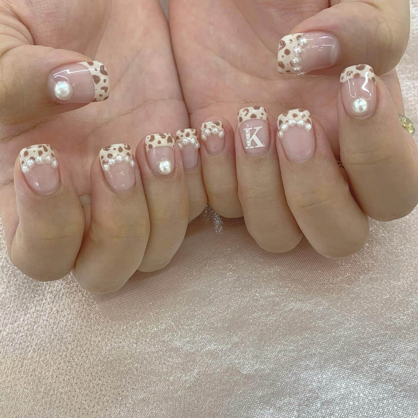 2. Soft Leopard Tips With Pearls - animal nail ideas