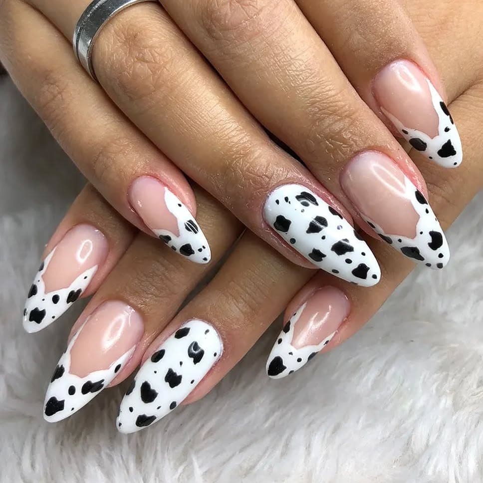 6. Minimal Cow Print Almonds - animal nail ideas