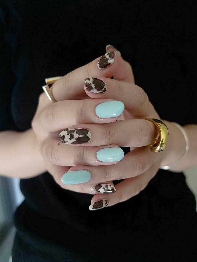 16. Mint Cow Duo With Soft Brown Spots - animal nail ideas