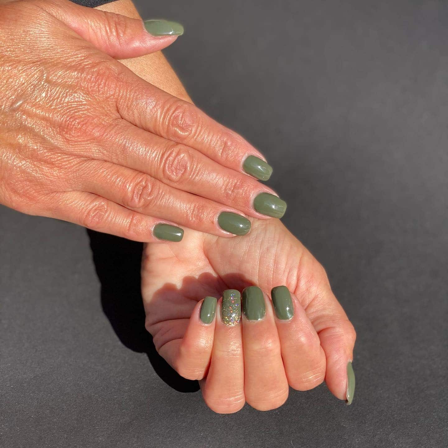 16. Classic Olive Short Nails With Glitter Accent - army green nail ideas