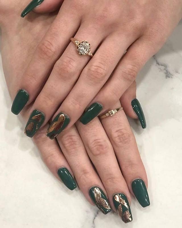 17. Deep Green Marble Accent Nails - army green nail ideas
