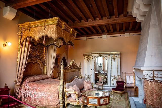 1. Baroque Majesty in Gold and Rosewood - royal bedroom ideas