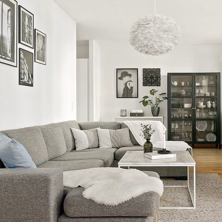 18. Cozy Grey Sectional With Black Display Cabinet - grey, black and white living room ideas