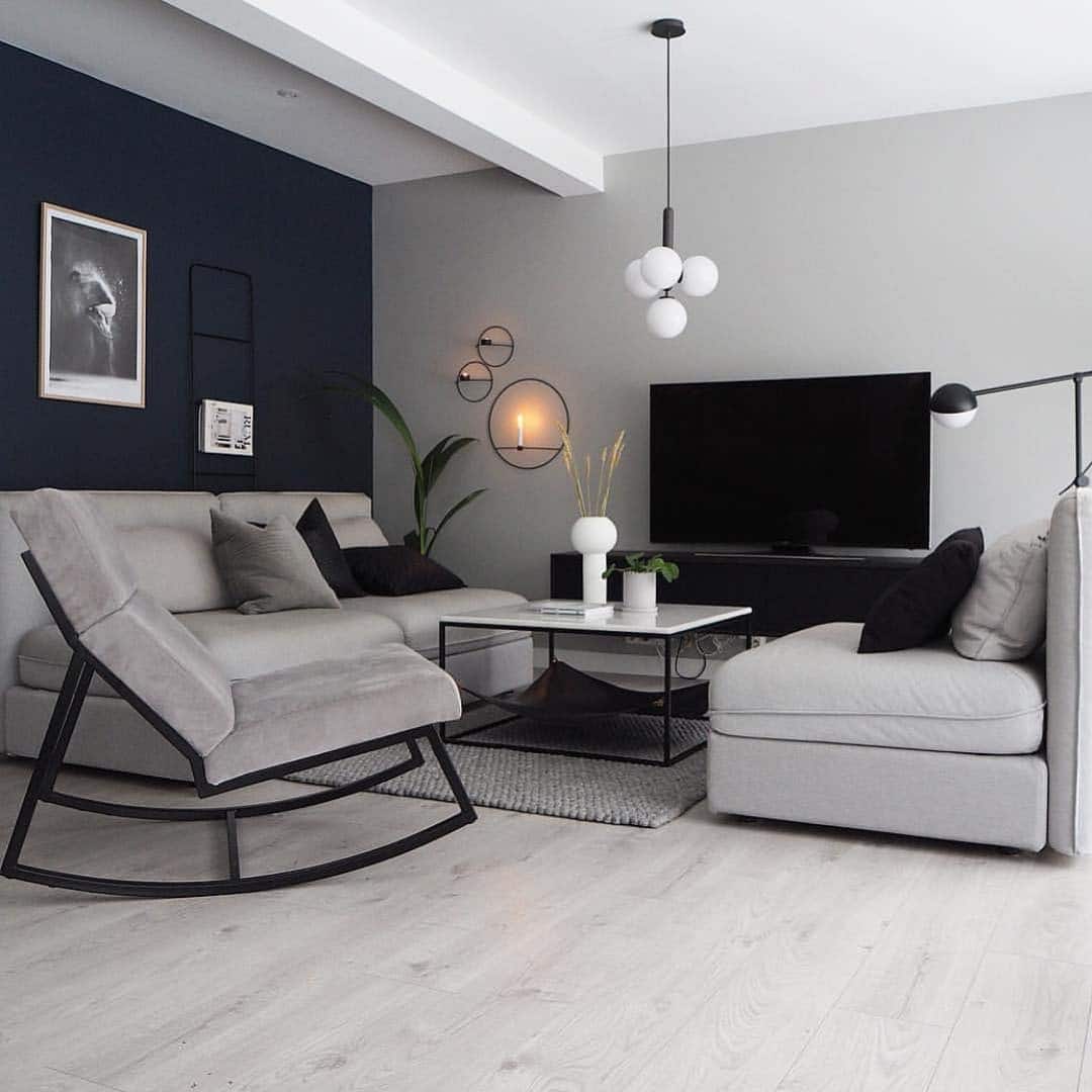 20. Contemporary Grey Layout With Statement Lighting - grey, black and white living room ideas