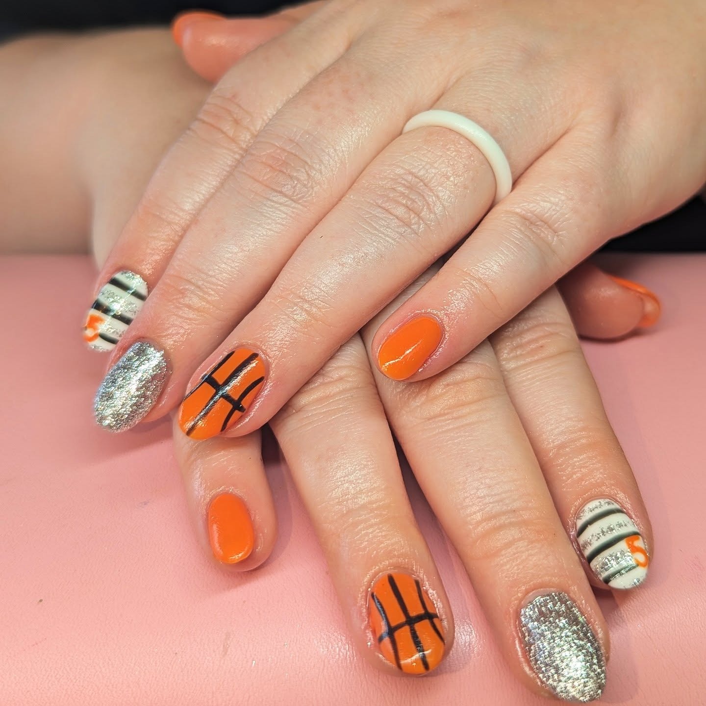 15. Orange Court Lines with Glitter Accent - basketball nail ideas