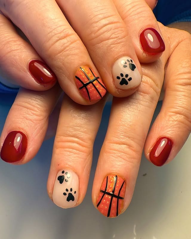 16. Red & Paw Print Basketball Combo - basketball nail ideas