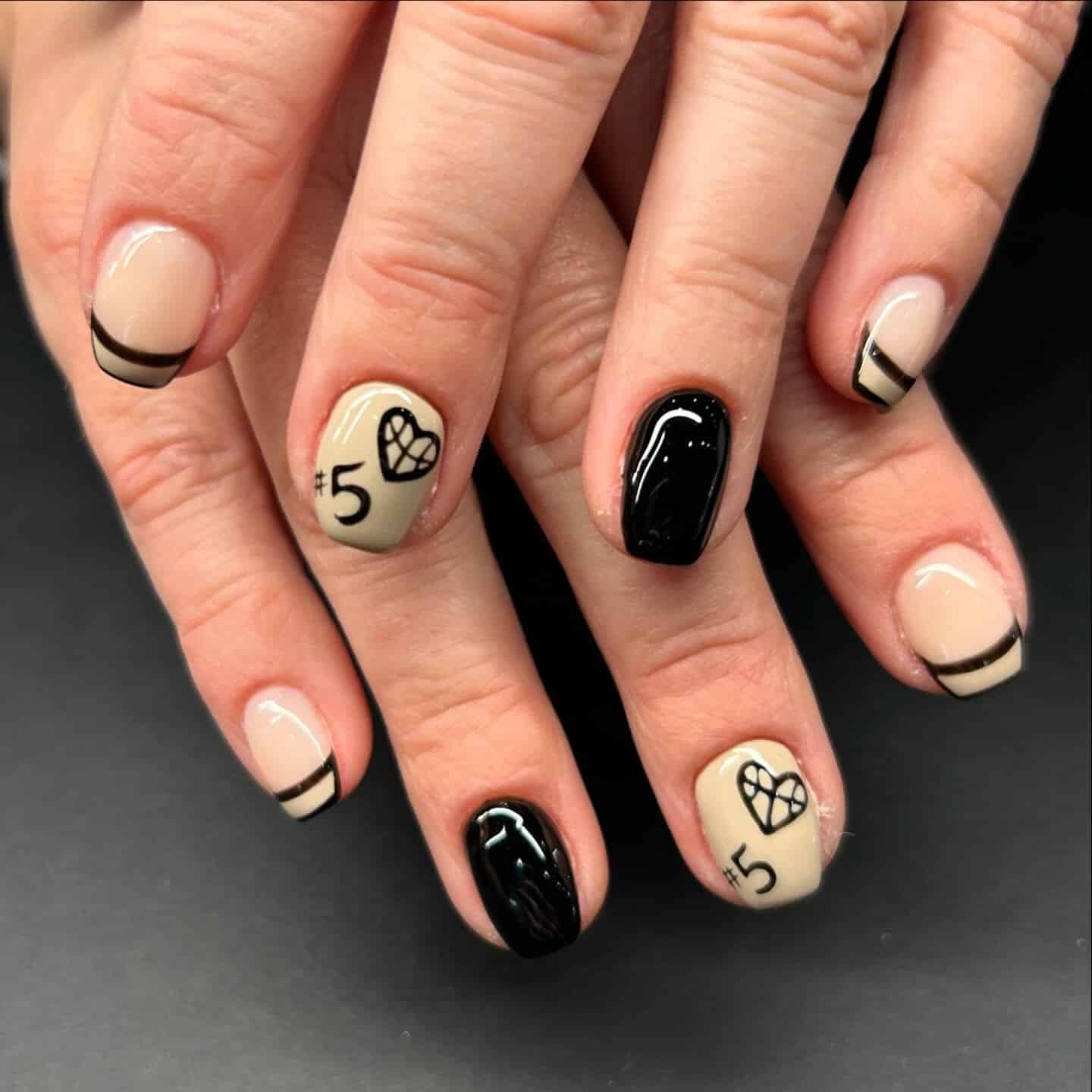 17. Neutral & Black Court Heart Nails - basketball nail ideas