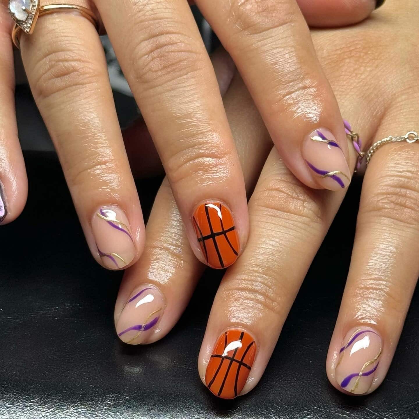 19. Purple Wave Art with Classic Court Accent - basketball nail ideas