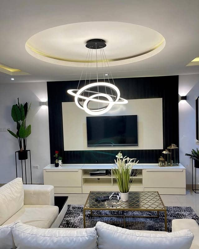 11. Modern Cream Lounge with Sculptural Lighting - classy living room ideas