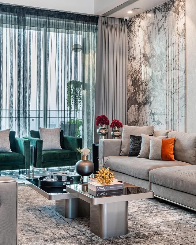 18. Metallic Elegance with Emerald Seating - classy living room ideas