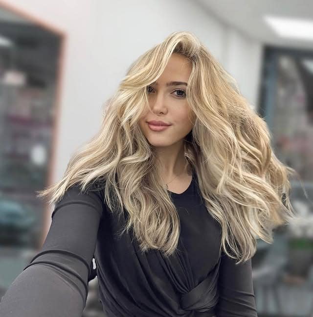 6. Voluminous Dirty Blonde Waves with Face Framing - Dirty Blonde Hair Color