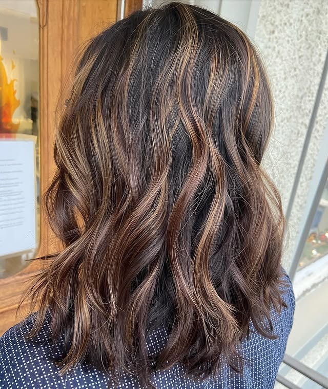 8. Voluminous Dark Brown Layers With Caramel Ribbons - Balayage Dark Brown Hair Color