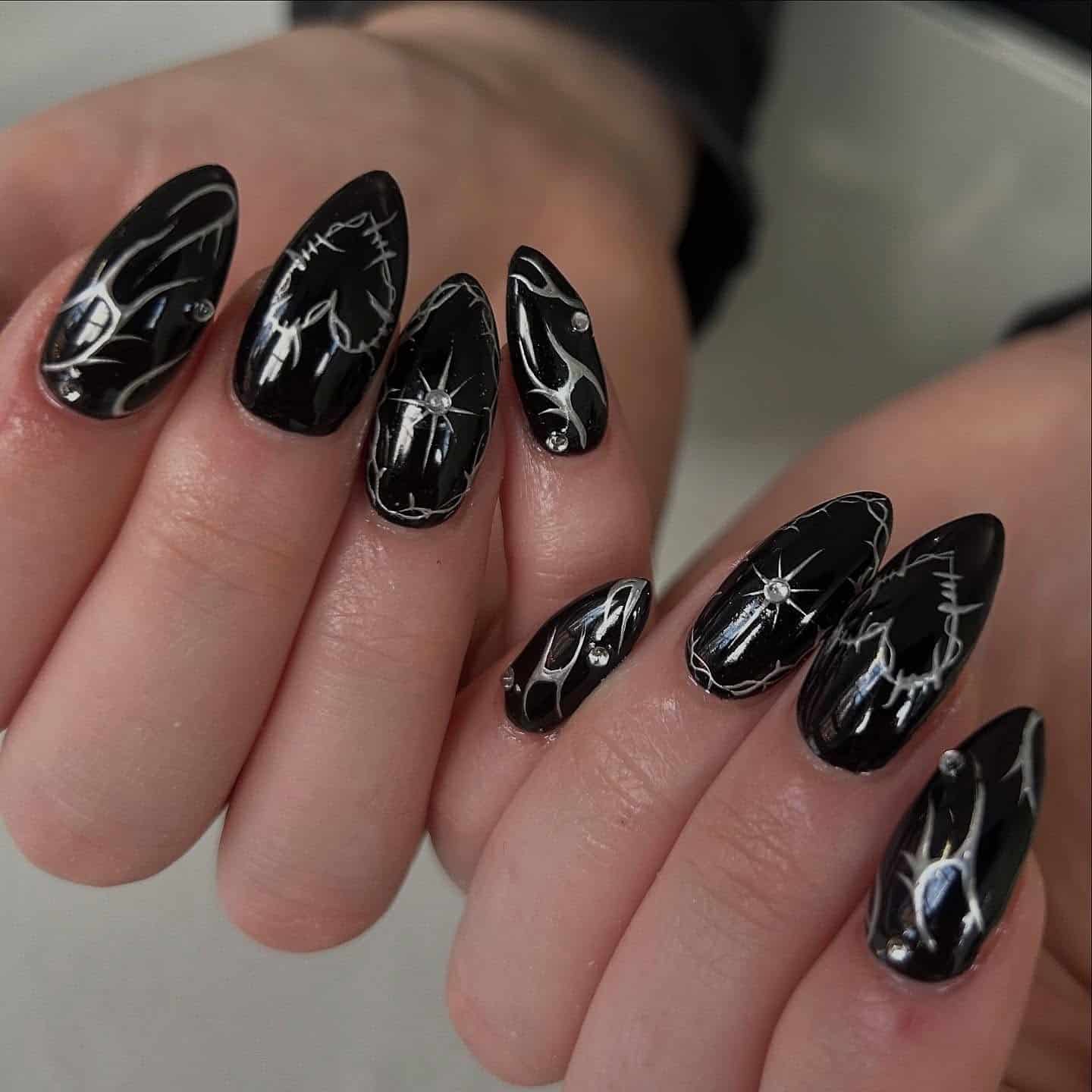 2. Black Lightning Marble with Crystal Points - black chrome nail ideas