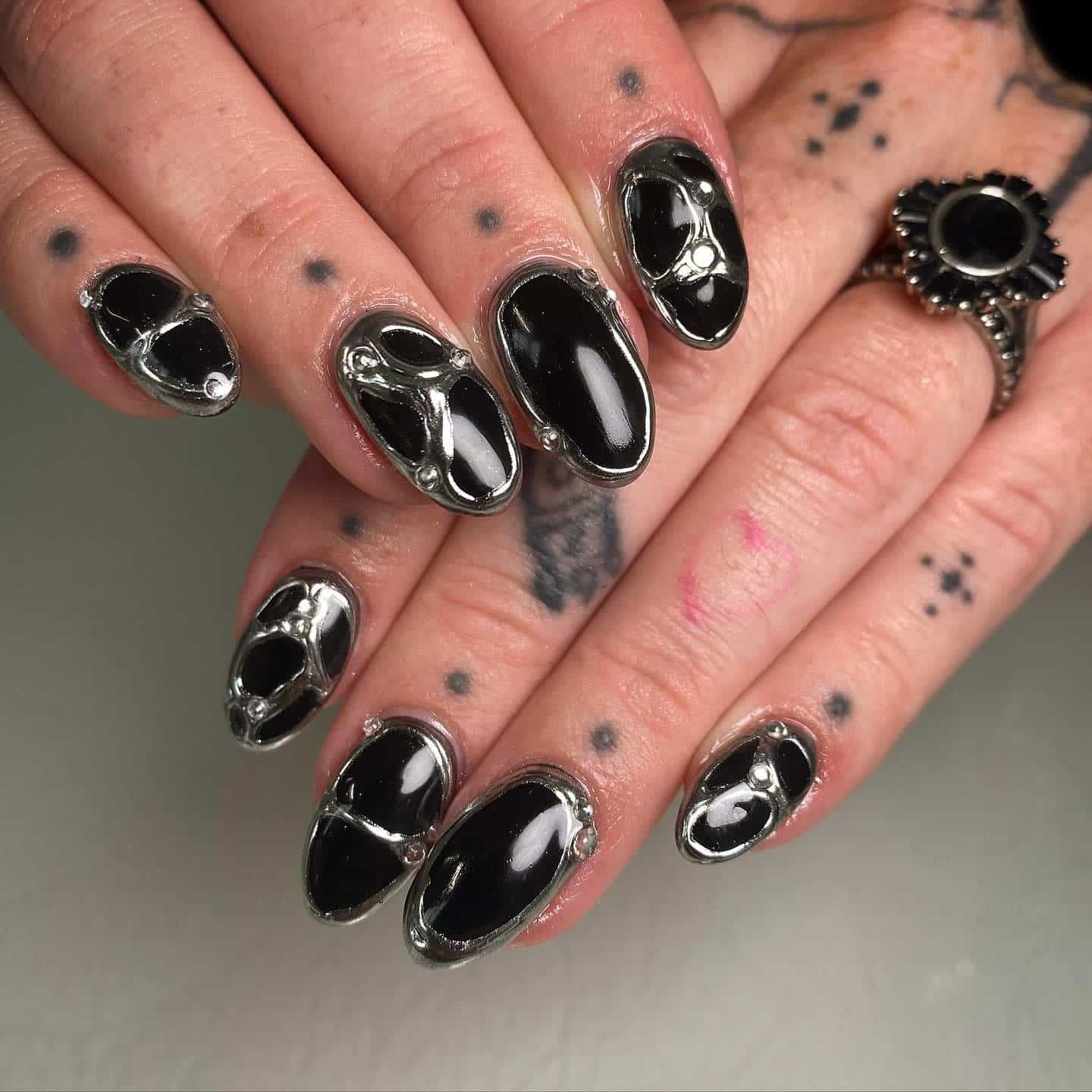 4. Heavy Metal Chrome Frame Nails - black chrome nail ideas