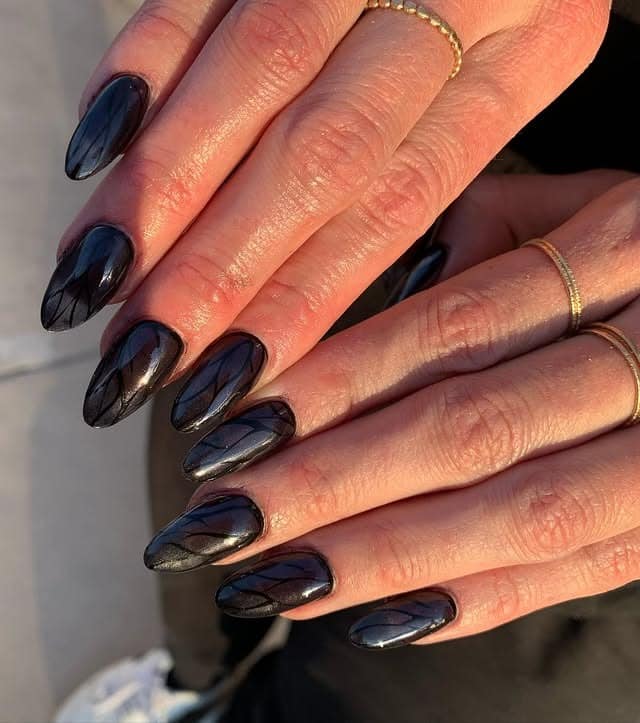 17. Dimensional Smoky Chrome Almond Nails - black chrome nail ideas