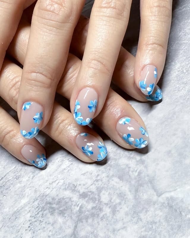 2. Petite Sky-Blue Florals on Sheer Pink - blue flower nail ideas