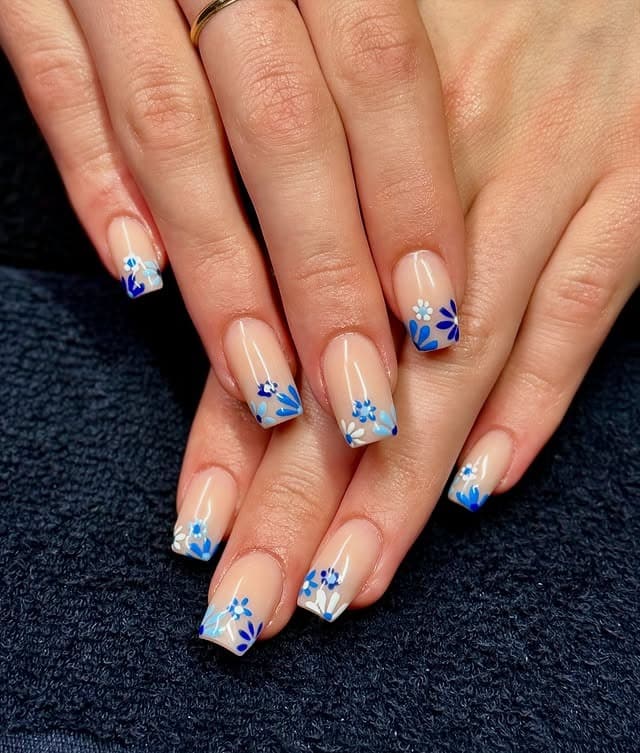 10. Square Tips with Layered Blue Garden Accents - blue flower nail ideas