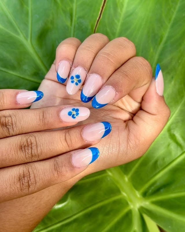 11. Royal Blue French Tips with Mini Floral Accents - blue flower nail ideas