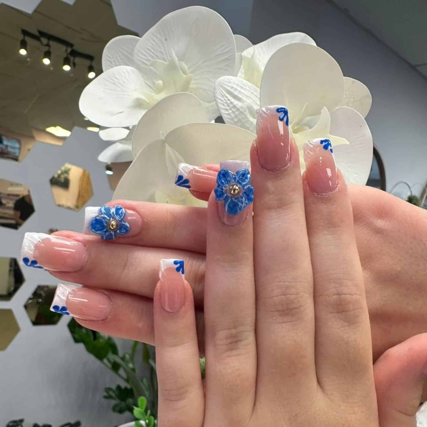 16. Square French Nails with Blue 3D Blooms - blue flower nail ideas
