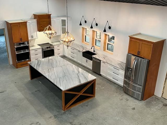 3. Two-Tone Cabinetry With a Striking Marble Island - barndo kitchen ideas